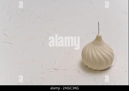 a beautiful handmade candle made of soy wax in the shape of a dome. Stock Photo