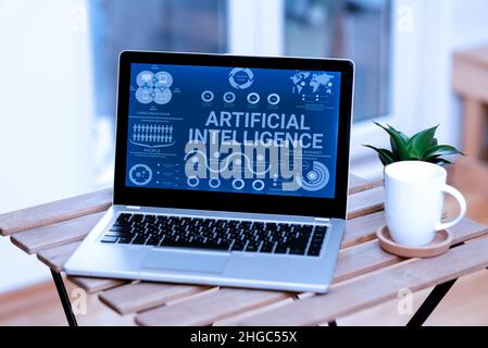 Writing displaying text Artificial Intelligence. Business approach programmed to think like human and mimic his actions Laptop Resting On A Table Stock Photo