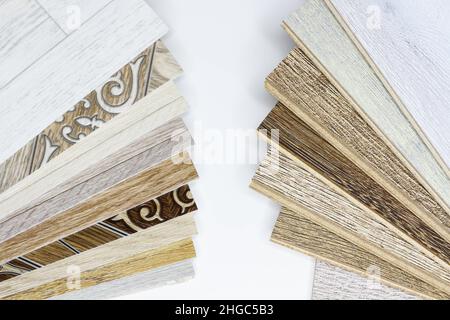 Laminate and linoleum. Choice between. Comparison of floor coverings. The advantages of linoleum over laminate. Pros and cons . Differences between fl Stock Photo