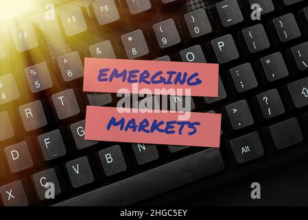Hand writing sign Emerging Markets. Concept meaning nations that are ...