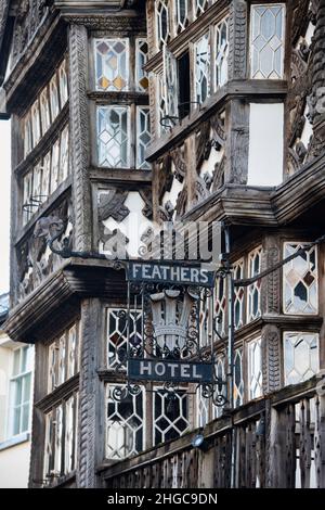 The Feathers hotel sign. 17th century timber framed period building. Ludlow, Shropshire, England Stock Photo
