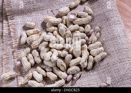 Peanut shell is cooked, with skin on. The peanut, also known as the groundnut, goober, pindar or monkey nut, and classified as Arachis hypogaea. Stock Photo