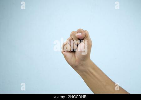 Man's hand gesturing isolated on a white background. Stock Photo