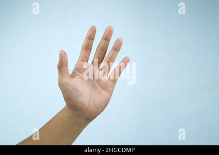 Man's hand gesturing isolated on a white background. Stock Photo