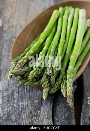 asparagus on wooden surface Stock Photo