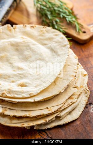 Arabic bread. Flat pita bread on wooden table. Stock Photo