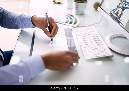 African Graphic Web Designer Using Design Editing Software Stock Photo