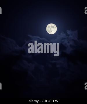 Beautiful Moon Light Between The Clouds In The Night Stock Photo
