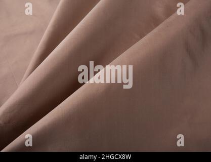 Close up of texture of hand woven Thai silk in earth tone color Stock Photo