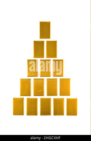 Gold bars laid with a pyramid. Isolated on a white background. Stock Photo