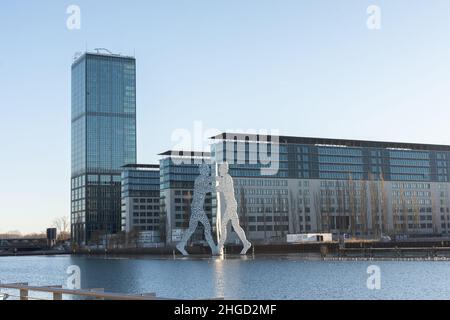 Berlin, Germany - December 26, 2021: view of the other shore from the Spree river embankment between the Oberbaunum bridge and Elsen Bridge Stock Photo