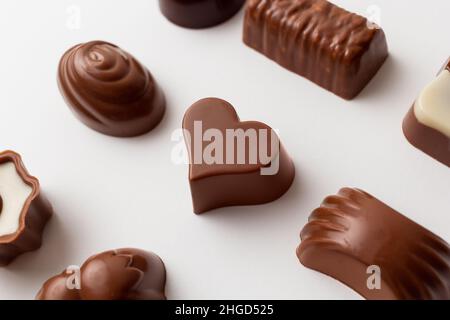 Chocolates with heart shape isolated on white background. Stock Photo