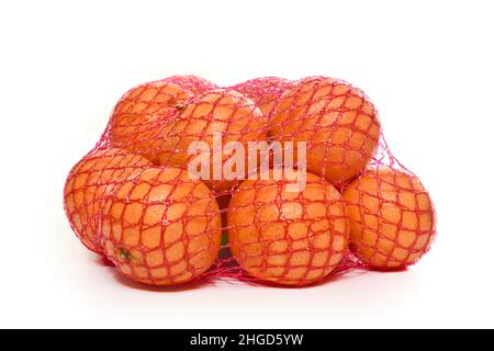 Ripe tangerines in bag isolated on white Stock Photo by ©belchonock 12569743