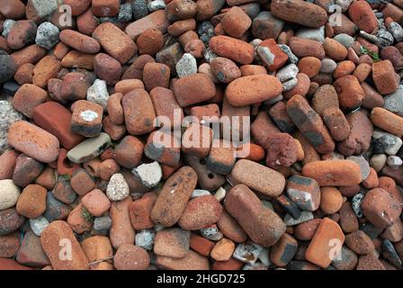 Crosby Beach on Merseyside is partly covered in tidal eroded bricks that were dumped there from ruins caused by Second World War German bombing. Stock Photo