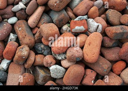 Crosby Beach on Merseyside is partly covered in tidal eroded bricks that were dumped there from ruins caused by Second World War German bombing. Stock Photo