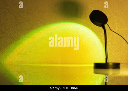 Sunset projector lamp close up. Multi colored RGB light. Home decor. Selective focus Stock Photo