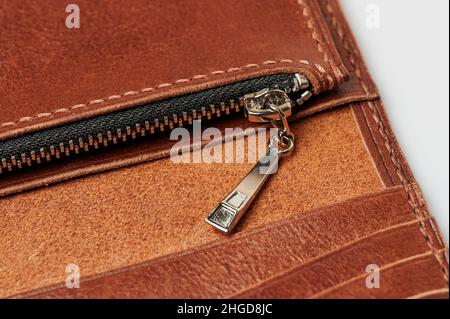 Closed zipper on leather bag macro close up view Stock Photo