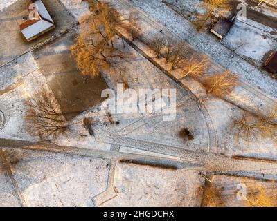 Snow-covered park and trees seen from above on a calm winter day. Winter. Stock Photo