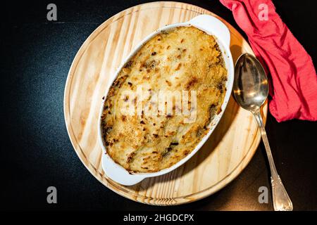 A Traditional potato pie or shepherd's pie made with meat and topped with potatoes. Homemade traditional cake. Aerial view. Stock Photo