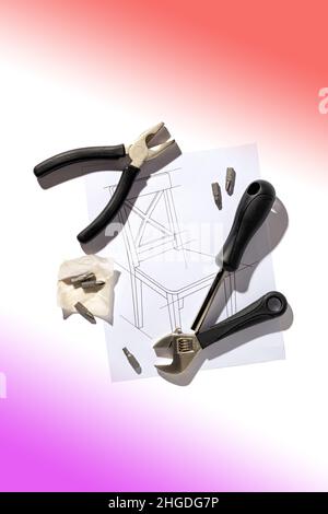 Furniture hand industrial tools and chair assembly drawing, close up, flat lay Stock Photo