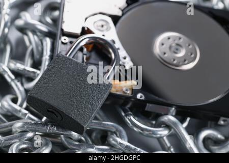 Data on cd rom secured with chain and padlock equipment, key hole Stock Photo