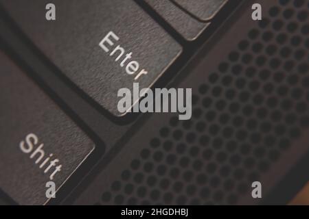 Close up shot of the enter key on a laptop computer Stock Photo