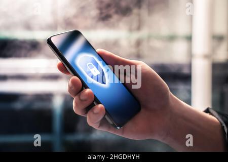 Cybersecurity in mobile phone against scam, hack and fraud. Encrypted smartphone. Password lock. Online data hacker. Cyber scammer using tech. Stock Photo