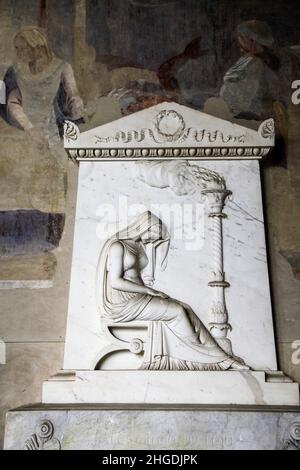 Roman period carved stone relief sarcophagus panel inside the Camposanto Monumentale cemetery. Pisa, Tuscany, Italy. Mourning woman Stock Photo