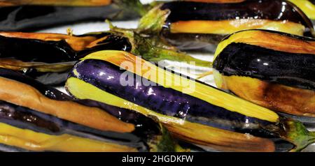 Karniyarik (Karnıyarık) is a popular classic Turkish dish. Karniyarik is an eggplant stuffed with minced meat with fried onions, garlic, tomatoes, pep Stock Photo