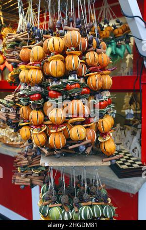 Spices, Herbs and Fruit for Christmas Mulled Wine on strings being sold at a Christmas stall in Bratislava, Slovakia Stock Photo