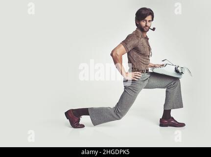 70's fashion. A young man dressed in 70's style clothing - isolated. Stock Photo