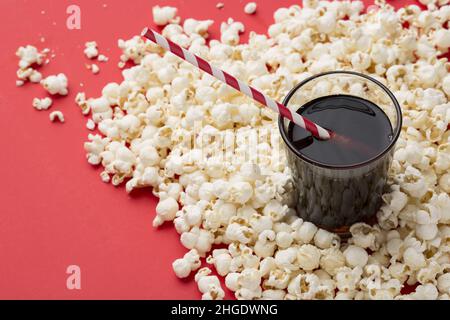popcorn on red textured background Stock Photo
