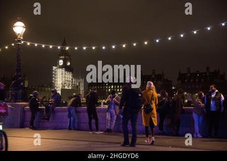 Elizabeth Tower of Big Ben is seen as revellers gather on Southbank in London on News Year’s Eve. Stock Photo