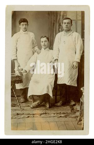 Original and probably rare studio portrait postcard of Staffordshire pottery workers. These young men are thought to be pottery workers as Fenton was a pottery town, one of the six that made up the 'Potteries' of  the city of Stoke on Trent. Perhaps they are the famous 'saggar makers bottom knockers' - an occupation that required unskilled young lads to knock the bottom of the saggar (Saggars were used to hold and protect pottery during kiln-firing), or the more skilled Frame Filler (an apprentice). Studio of L. Bowler, Foley Goldenhill Rd, Fenton, Stoke-on-Trent, Staffordshire, U.K. circa 191
