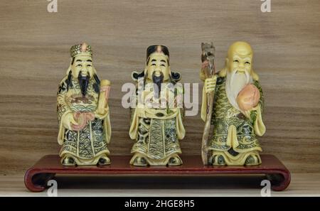 Three Chinese lucky gods.Fu Lu Shou – The Three Star Gods of China.These represent happiness and prosperity, status,authority, health, and longevity. Stock Photo