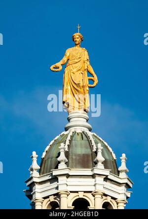 View of the gold statue statue representing Fame, on top of central octagonal dome of the Bank of Scotland, the Mound, Edinburgh. Stock Photo