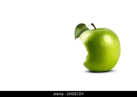 Bitten Granny Smith apple with a leaf on a white background. Stock Photo