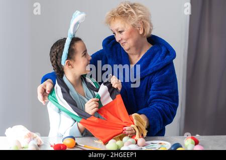 grandmother and granddaughter with uae flag for easter Stock Photo
