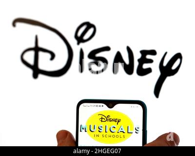 Ukraine. 20th Jan, 2022. In this photo illustration, the Disney Musicals in Schools logo is seen displayed on a smartphone screen with the Disney logo in the background. (Credit Image: © Igor Golovniov/SOPA Images via ZUMA Press Wire) Stock Photo