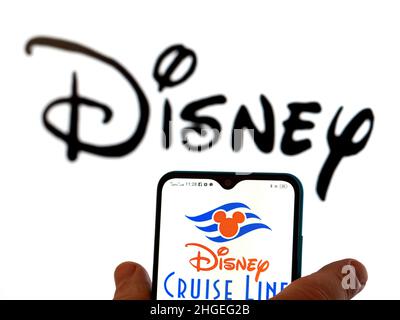 In this photo illustration, the FX Networks logo is displayed on a  smartphone screen with a Disney logo in the background Stock Photo - Alamy