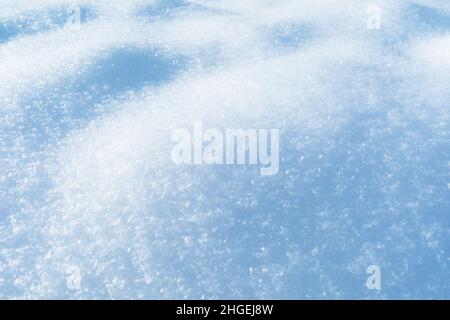 Snow texture illuminated by sunlight, snow background Stock Photo