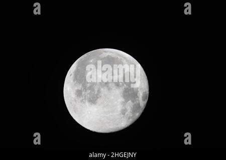 A full moon on a dark sky Stock Photo