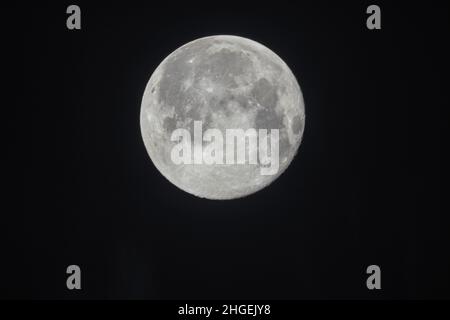 A full moon on a dark sky Stock Photo
