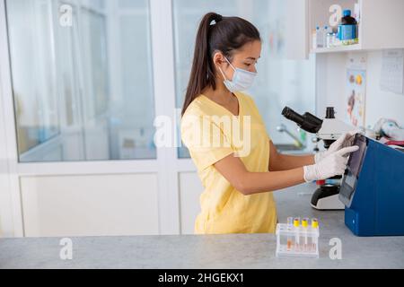 Young specialist working with analyzes in vet laboratory Stock Photo