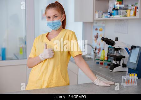 Young female veterinarian standing in veterinary clinic Stock Photo