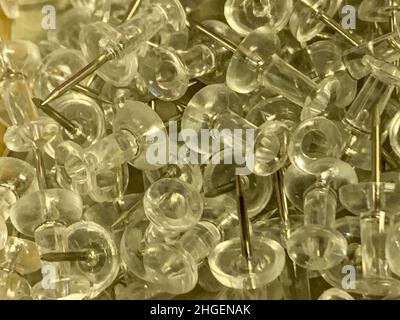 Push Pins in a pile on wooden desk close up. High quality photo Stock Photo