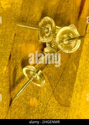 Push Pins in a pile on wooden desk . High quality photo Stock Photo