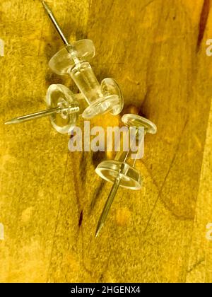 Push Pins in a pile on wooden desk . High quality photo Stock Photo