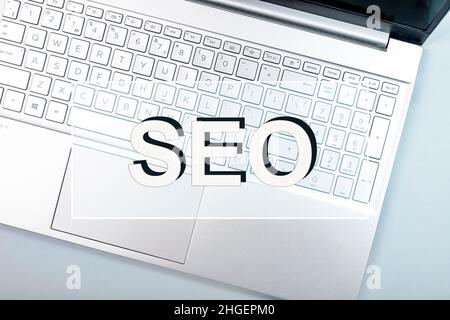 SEO concept. Acronym word on photo with laptop keyboard. Stock Photo
