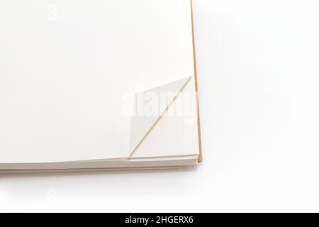 Paper page corner folded on a note pad Stock Photo